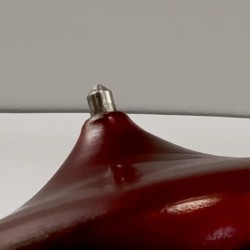 Malaysian plate spinning top